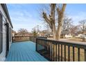 Relax on the expansive front porch with a blue floor, perfect for enjoying the outdoors at 317 Albany St, Indianapolis, IN 46225