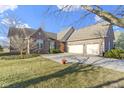 Lovely brick home with a well-maintained lawn and ample parking space at 3520 Inverness Blvd, Carmel, IN 46032