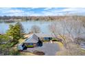 Aerial view of home with lake access and meticulously maintained landscaping at 5406 Allisonville Rd, Indianapolis, IN 46220
