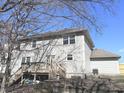 Backyard showcasing a spacious layout, multi-level deck, and mature trees at 632 Middleham Cir, Beech Grove, IN 46107