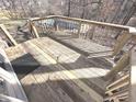 Wooden deck with railing, offering outdoor entertaining space overlooking the backyard at 632 Middleham Cir, Beech Grove, IN 46107