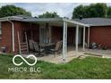 Covered back patio featuring a seating area, perfect for outdoor dining and entertaining at 6721 Jackson St, Anderson, IN 46013