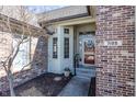 Welcoming front entrance featuring an elegant door with sidelights and a brick facade at 7195 Koldyke Dr, Fishers, IN 46038