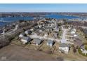 Neighborhood aerial view of homes on large lots near a lake at 7675 Winding Lake S Dr, Noblesville, IN 46062