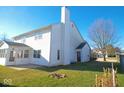 The back exterior features a door, a sunroom with windows, and a partially visible backyard at 777 West St, Whiteland, IN 46184