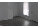 Inviting living room features modern gray flooring and neutral walls at 1311 N Olney St, Indianapolis, IN 46201