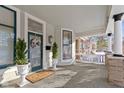 Inviting front porch with decorative wreath, potted greenery, and stylish accents create a welcoming entrance at 1471 N Delaware St, Indianapolis, IN 46202