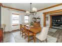 Bright dining room with wood table, natural light, and open access to the living area, creating a seamless flow at 1622 E Mohr Rd, Greenfield, IN 46140