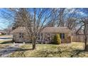 Charming single-story home featuring stone and vinyl siding with a well-manicured front yard at 21 E Tilden Dr, Brownsburg, IN 46112