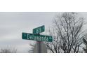 Image of a street sign indicating the intersection of E 16th St and S Delawanda Ave at 2212 S Delawanda Ave, Muncie, IN 47302