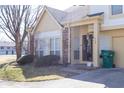 Two-story home with attached garage, covered front entryway, and compact, well-maintained landscaping at 2449 Chaseway Ne Ct # Blk B, Indianapolis, IN 46268