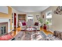 Cozy living room with hardwood floors, fireplace, and natural light, offering a warm and inviting atmosphere at 5935 Compton St, Indianapolis, IN 46220