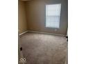 Bright bedroom features new carpet and a large window at 6030 Tybalt Cir, Indianapolis, IN 46254