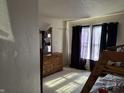 Bright bedroom with carpet, natural light, a dresser, and a bunk bed with a view of outside at 6647 Black Antler Cir, Indianapolis, IN 46217