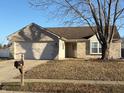 Inviting single Gathering home with two car garage, large driveway and a mailbox at 102 Azalea Dr, Mooresville, IN 46158