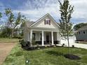 Inviting single-Gathering home featuring a covered porch, fresh landscaping, and a well-maintained front yard at 14383 Coyote Ridge Dr, Noblesville, IN 46060