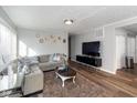 Cozy living room with hardwood floors, neutral walls, and ample natural light from large windows at 1459 E Lynn Dr, Indianapolis, IN 46202