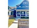 Attractive home with a cozy front porch, landscaped yard, and inviting entrance at 1505 S Alabama St, Indianapolis, IN 46225