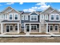 New townhouse exterior displaying brick accents and varied siding and roof lines at 19493 Grassy Branch Rd, Westfield, IN 46074