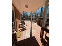 Open deck with seating, playhouse, and access to the backyard at 28 Cambridge Ct, Anderson, IN 46012