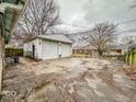 Two-car detached garage with a wide concrete driveway and a spacious backyard at 3423 N Sadlier Dr, Indianapolis, IN 46226