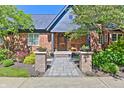 Charming brick home featuring a lovely front door and landscaped walkway at 6778 Old Hunt Club Rd, Zionsville, IN 46077