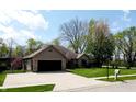 Charming single-story home with an attached garage and well-kept lawn at 7987 Teal Dr, Coatesville, IN 46121