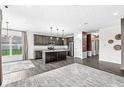 Open-concept kitchen featuring stainless steel appliances and granite counters at 9442 Orchard Cove Dr, Indianapolis, IN 46239