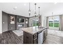 Modern kitchen overlooking the living area and features an island with a sink at 9442 Orchard Cove Dr, Indianapolis, IN 46239