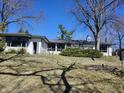Ranch style home featuring a front yard and white painted brick under a clear blue sky at 10821 E County Road 750 N, Brownsburg, IN 46112