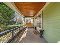 Inviting front porch with porch swing and decorative railing at 140 E 44Th St, Indianapolis, IN 46205