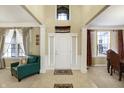 Elegant foyer boasts high ceilings, decorative pillars, and a welcoming atmosphere at 14347 Camelot House Way, Fishers, IN 46037