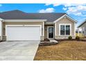 Single Gathering house featuring an attached garage and a well-maintained lawn at 1609 Clover Crossing Dr, Greenfield, IN 46140