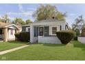 Inviting single-Gathering home with a cozy front porch and a well-kept lawn at 1817 Medford Ave, Indianapolis, IN 46222