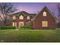 Beautiful two-story brick home with manicured landscaping, showcasing a welcoming facade at 2163 Laurel Leaf Ln, Avon, IN 46123