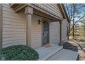 Inviting front porch with neutral siding and a stylish entry door at 2215 Van Ness Pl, Indianapolis, IN 46240
