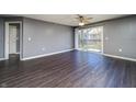 Bright living room featuring stylish flooring and sliding glass door to balcony, creating an inviting atmosphere at 240 Legends Creek # 206, Indianapolis, IN 46229