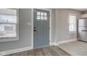 Welcoming entryway with stylish gray door, ample natural light, and modern flooring at 301 Villa Ave, Indianapolis, IN 46201