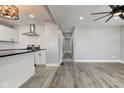 Open-concept living room and kitchen showcase modern design with sleek finishes and plenty of space at 301 Villa Ave, Indianapolis, IN 46201