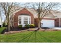 Attractive home with a brick facade, bay window, lush lawn, and meticulously landscaped front yard at 3509 Heathcliff Ct, Westfield, IN 46074