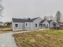 This exterior view showcases a quaint home with well-maintained landscaping and a cozy, inviting appeal at 3918 Columbus Ave, Anderson, IN 46013