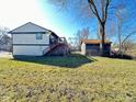 Spacious backyard with a shed and partial fencing, offering ample outdoor space at 4144 Richelieu Rd, Indianapolis, IN 46226