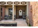 Inviting front porch with comfortable seating, decorative accents, a welcoming wreath, and a charming ambiance at 4287 Prairie Falcon Dr, Zionsville, IN 46077