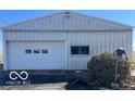 Exterior of a large detached garage with white siding and door at 4823 S State Road 75, Jamestown, IN 46147