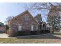 Charming brick two-story home with manicured lawn and inviting entryway at 4927 Auburn Ford, Greenwood, IN 46142