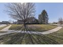 Charming brick two-story home with manicured lawn and inviting entryway at 4927 Auburn Ford, Greenwood, IN 46142