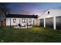 Outdoor fire pit with seating, perfect for entertaining in this lovely backyard at 536 W 52Nd St, Indianapolis, IN 46208