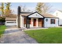 Beautifully renovated one-story home with covered porch and detached garage at 536 W 52Nd St, Indianapolis, IN 46208