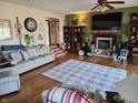 Inviting living room featuring hardwood floors, fireplace, and a cozy seating area at 551 E 600 S, Lebanon, IN 46052