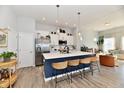 Bright, modern kitchen with a large island, stainless steel appliances, and open floor plan at 568 Lagerfield Dr, Carmel, IN 46032